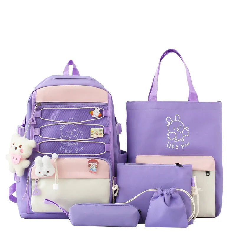 Solid colour nylon school backpack with curved shoulder straps, shown in black, blue, pink, and purple options.
