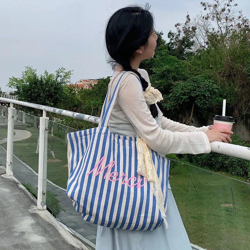 Blue and white striped cotton canvas bag with printed letter detailing for daily matching