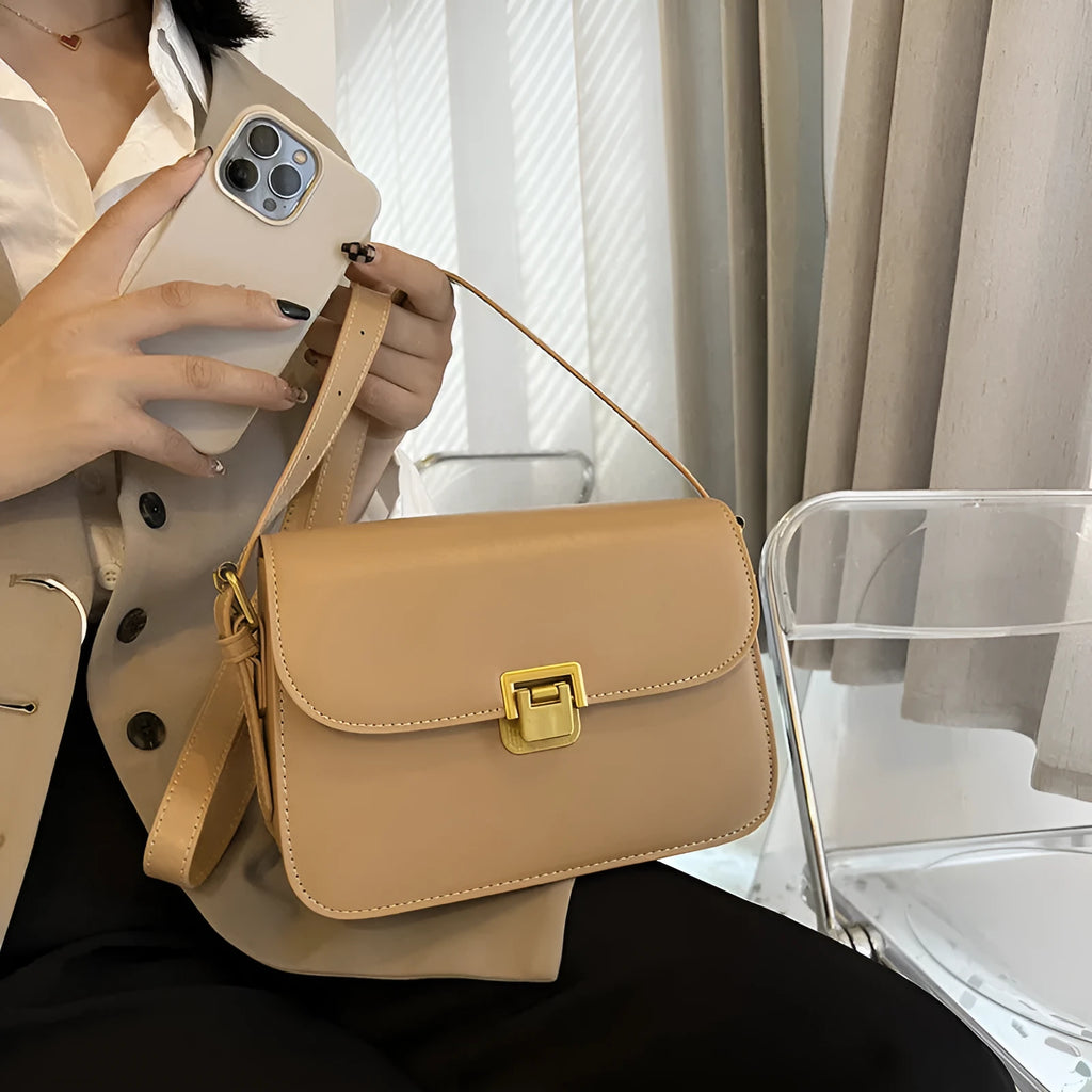 Soft PU leather women's small square shoulder bag in black with one-shoulder underarm carry design