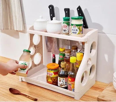 Foldable kitchen storage rack with multi-layer white shelving for organised kitchen supplies