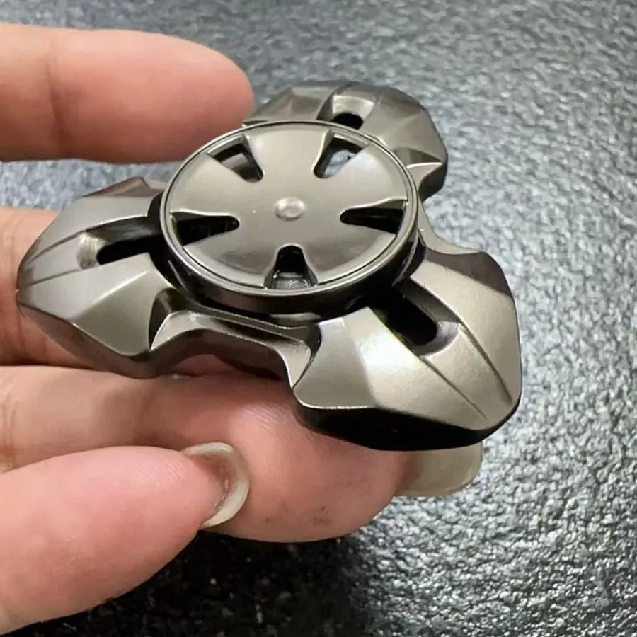 Alloy metal rotating fingertip gyro decompression toy in gun colour and colourful options.