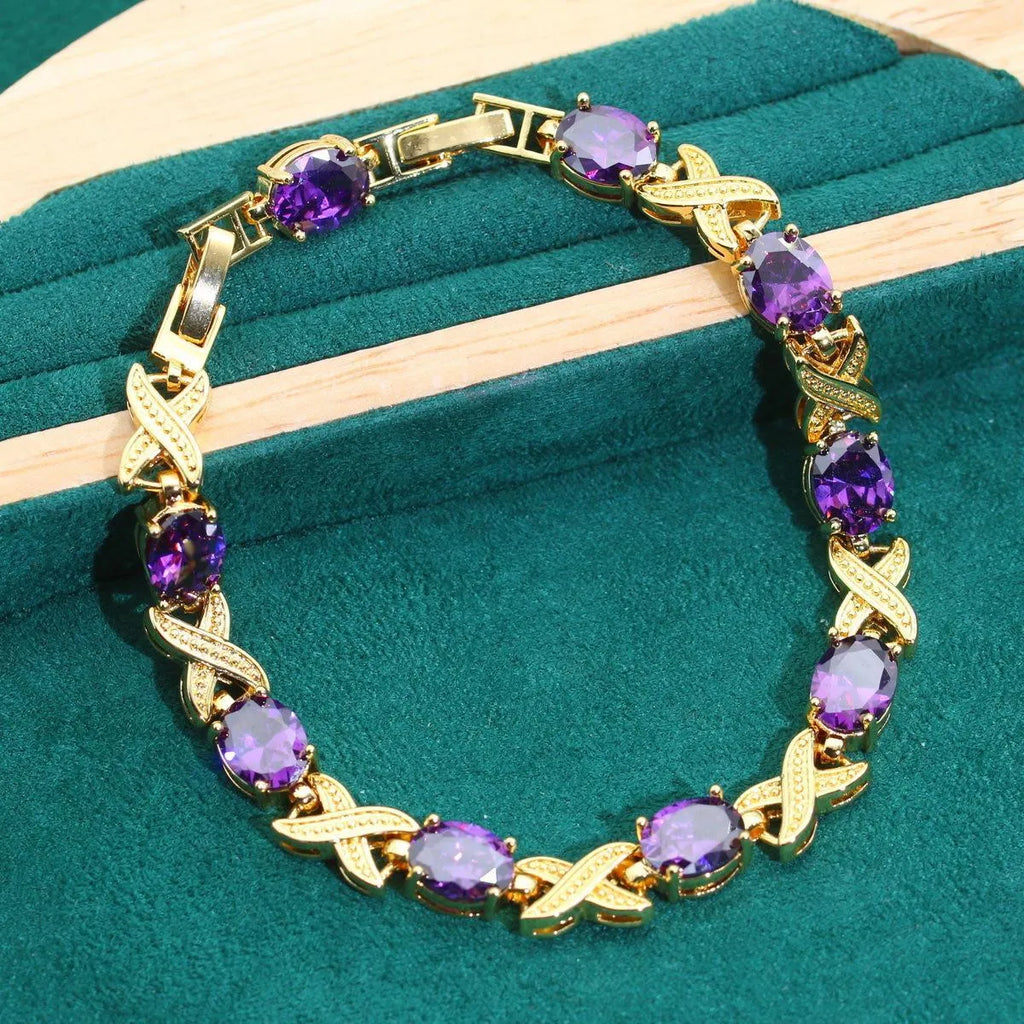 Gold plated jewellery set with multi-colour zircon stones, showing necklace, earrings, bracelet, and ring.