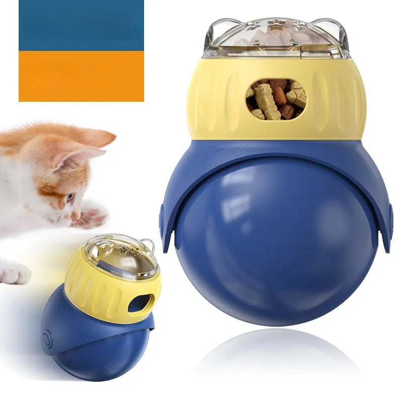 Yellow and blue plastic tumbler owl cat puzzle feeder for self-service food dispensing.