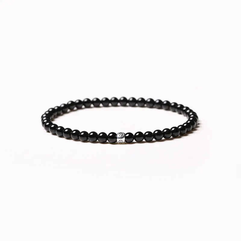 Fine unisex bracelet with blue San, black agate, and obsidian beads in a geometric 4mm design.