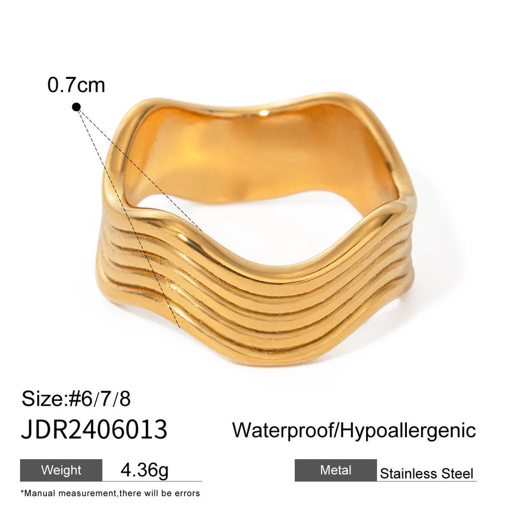 Stainless steel geometric wave ring with wide band design in silver and gold colour options.