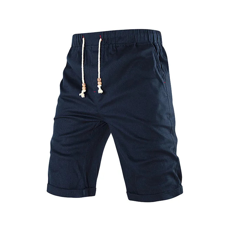 Man wearing grey cotton blend straight leg sports shorts with a drawstring waist and a zipper side pocket.