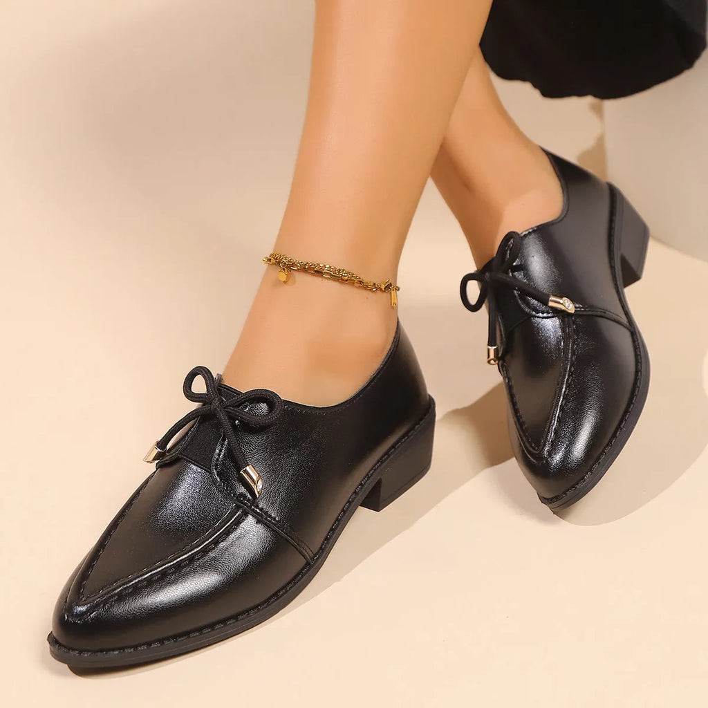 Women's British-style leather shoes with bow decoration, pointed toe, and slip-on design