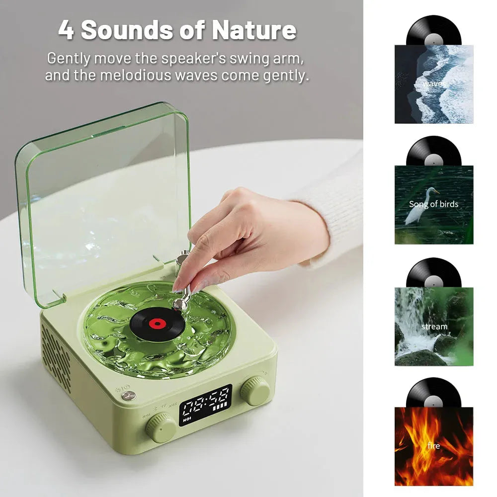 Blue retro-style Bluetooth speaker with rotating transparent turntable and RGB projection lighting