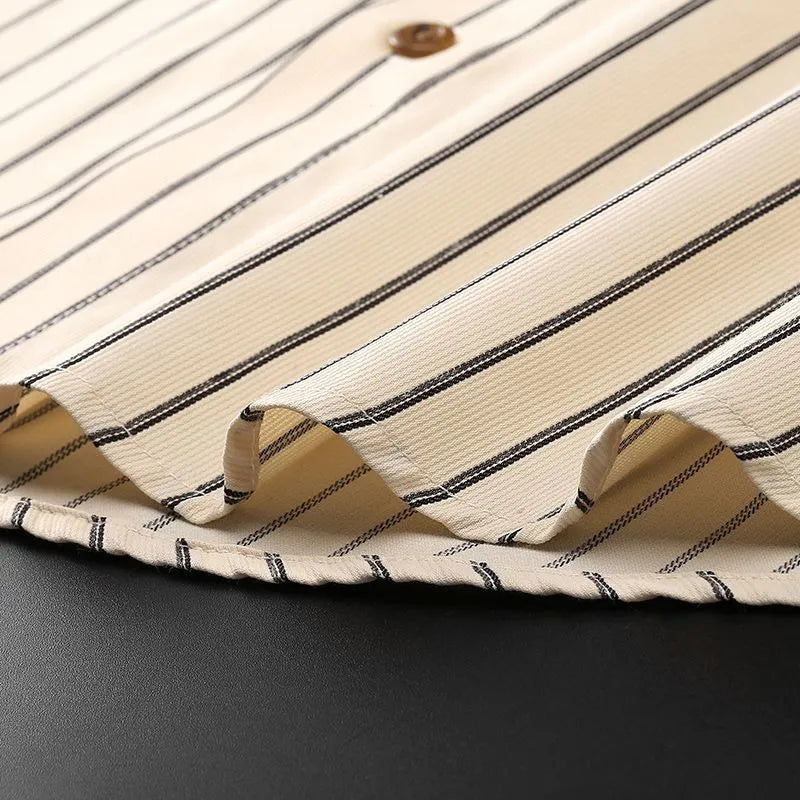 Coffee coloured striped men's long-sleeved shirt with a slim fit on a hanger.