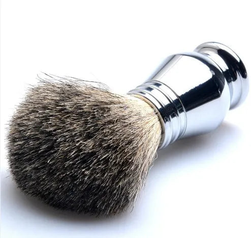 CSB shaving set with chrome stand holding a double edge safety razor and a badger hair brush, with a zinc alloy soap bowl and blades.