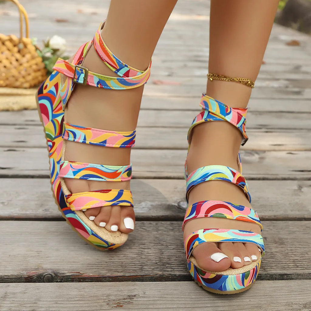 Women's buckle strap wedge sandals with fish mouth toe design in PU material.