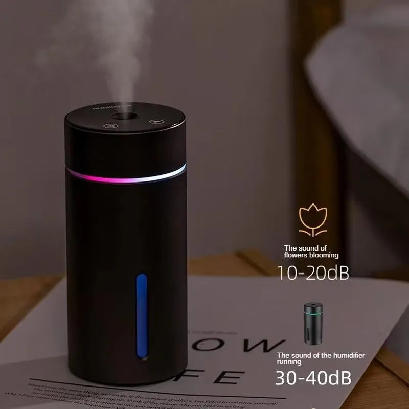 Black aluminium portable car humidifier diffuser with night light on a car dashboard