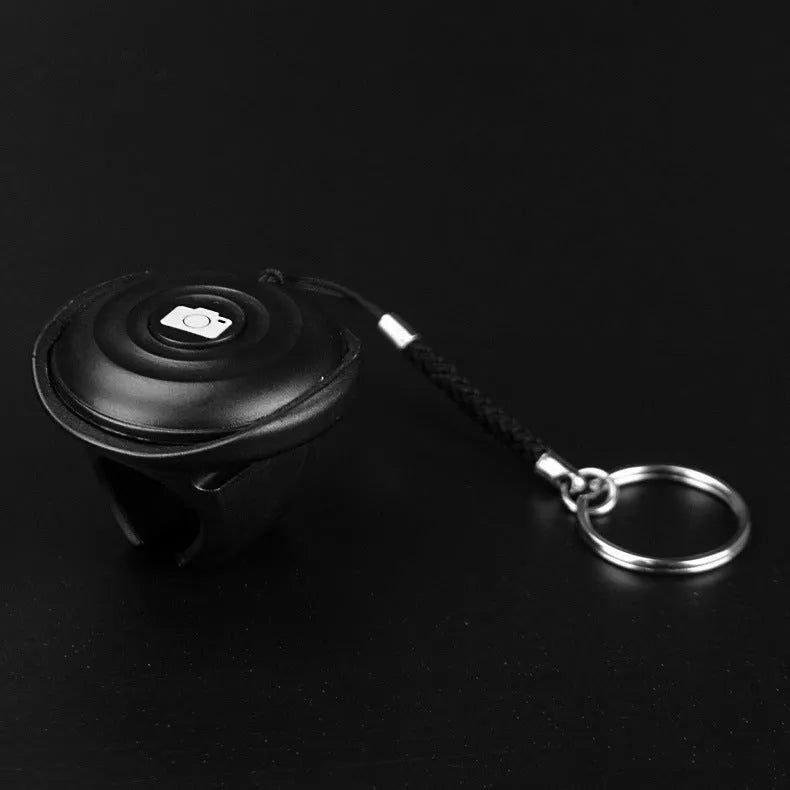 Black Snap Bluetooth wireless remote shutter control for smartphones and cameras.