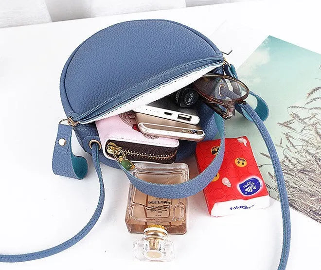 Women's round PU leather crossbody bag in circular shape, 17cm wide, with separate pouch