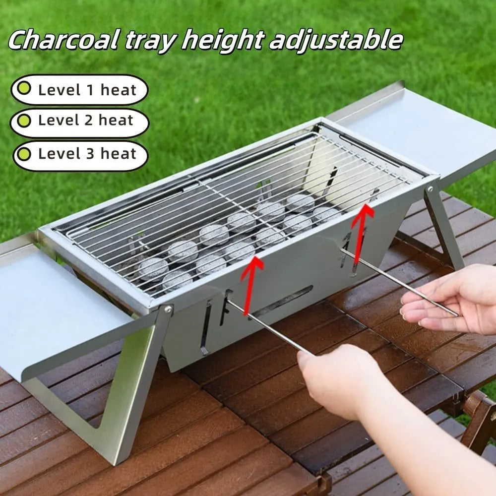Small foldable portable charcoal grill for outdoor cooking.