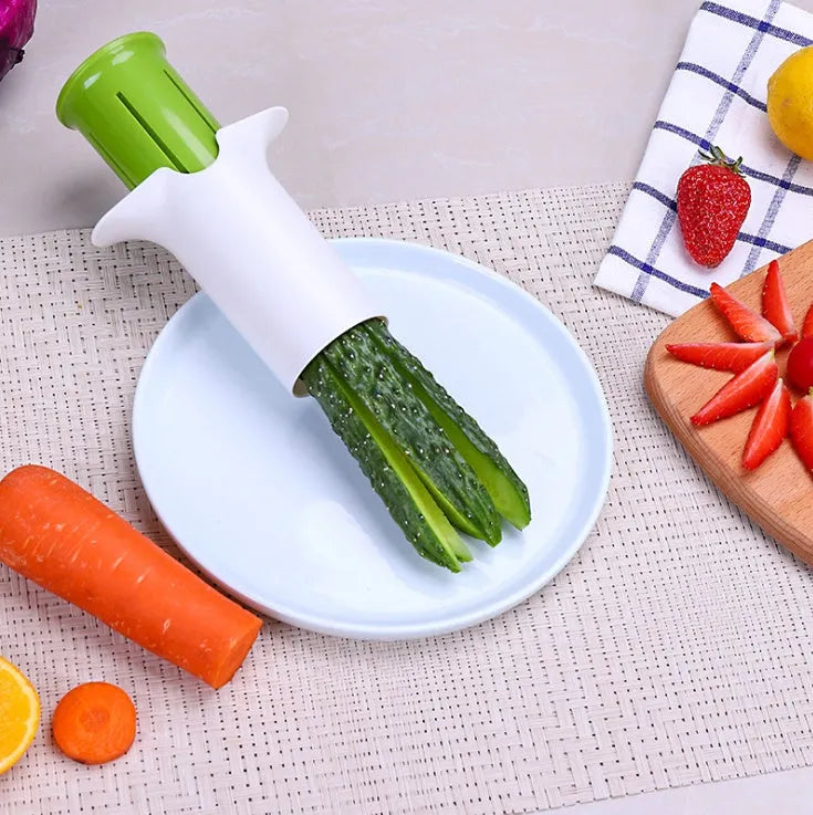 White kitchen vegetable fruit slicer with six stainless steel blades for cutting cucumbers carrots strawberries.