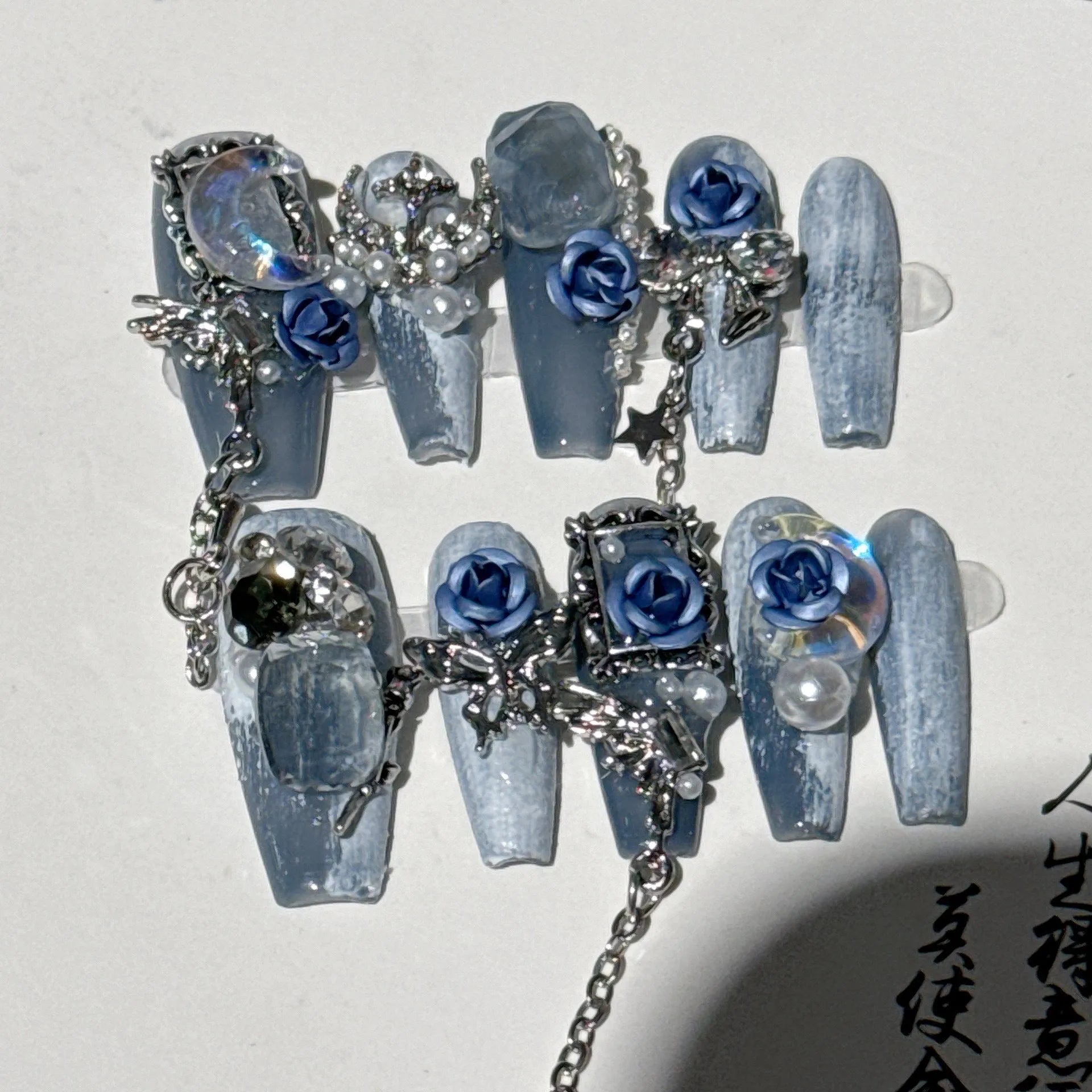 Heavy industry night blue false nails with rose and floral patterns in plastic armour suit
