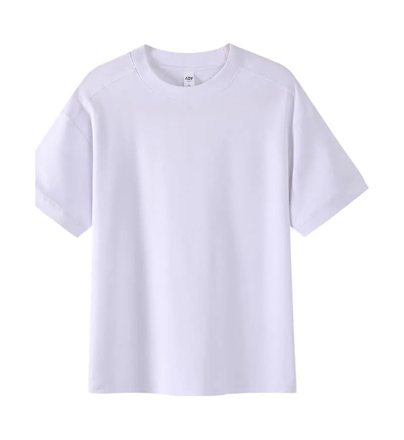 Man wearing a light grey pique cotton short sleeve t-shirt with a loose fit.