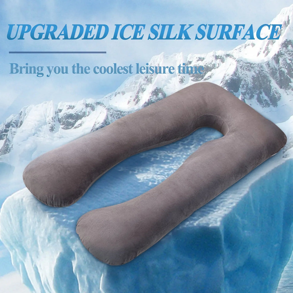 U-shaped pregnancy pillow in light blue ice silk fabric on a bed.