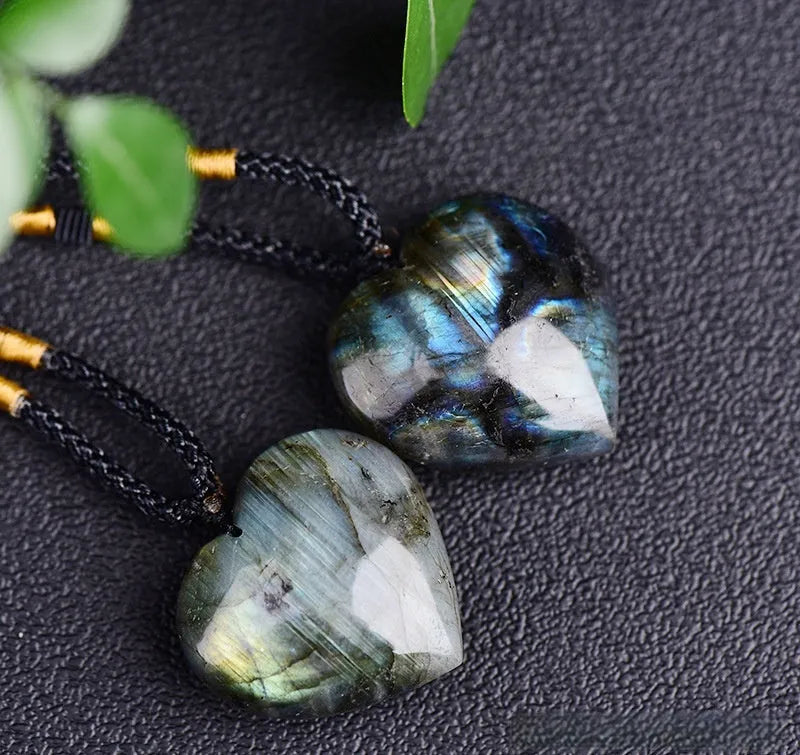 Natural labradorite moonstone crystal necklace with geometric blue pendant on a silver chain.