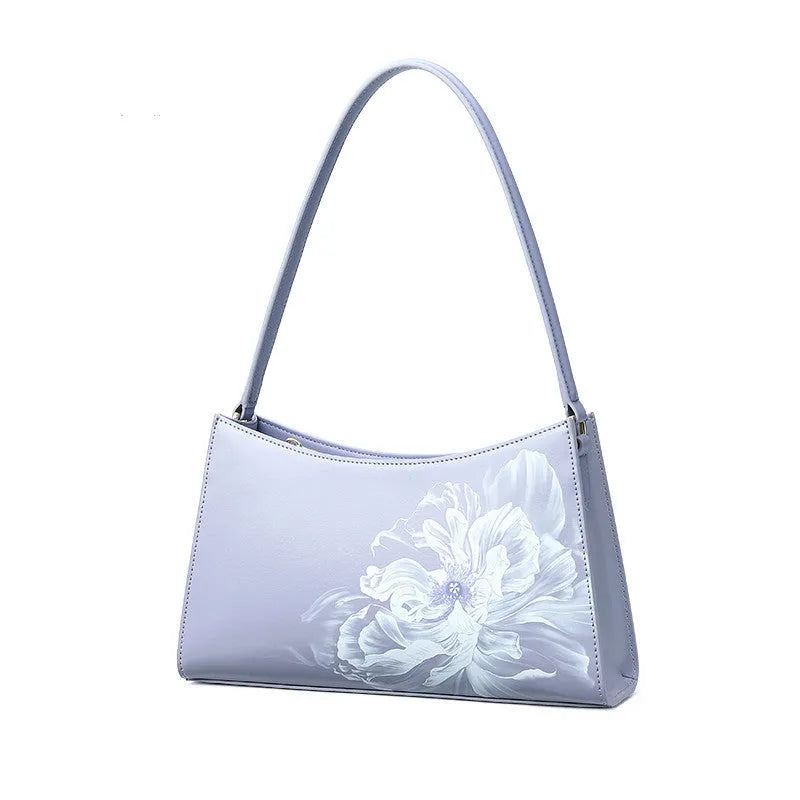 Light purple cowhide leather handbag with zipper closure, compact size for everyday use