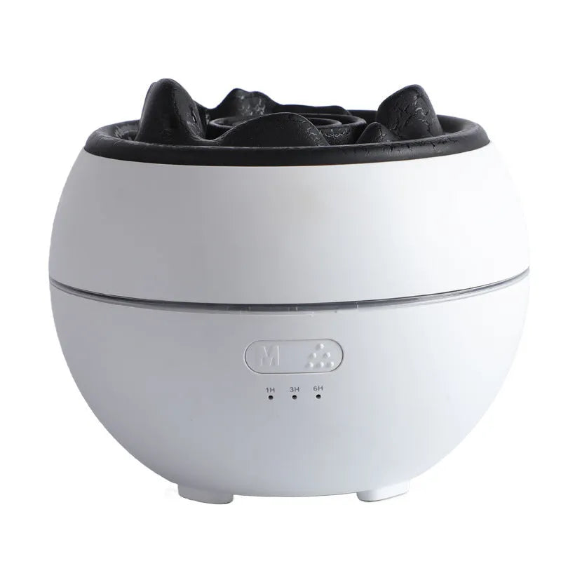 White round desktop flame aroma diffuser and humidifier with USB plug on a wooden table.