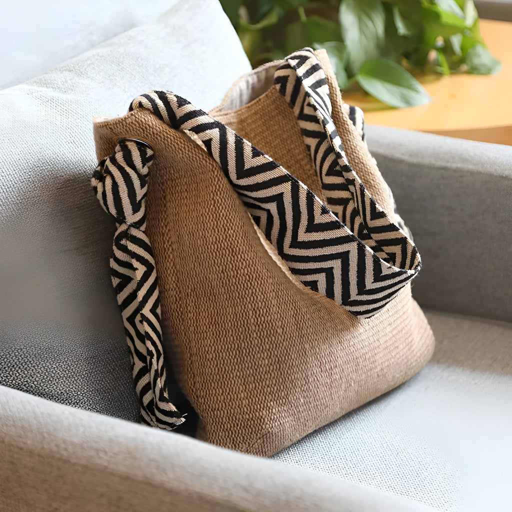 Khaki one-shoulder polyester canvas tote bag with cotton lining, magnetic closure, and internal pockets on a plain background