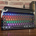 Black retro-style mechanical keyboard with colourful backlit keys on a desk.
