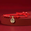 Cinnabar ethnic bracelet with braided rope strap and blessing charm for exam luck symbolism