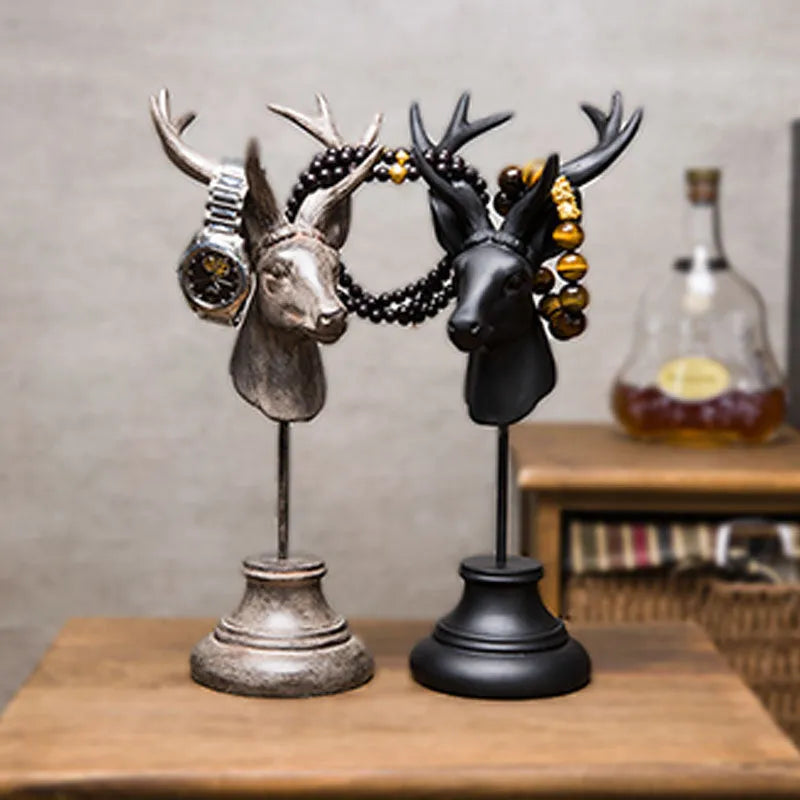 A tall black resin animal sculpture ornament for home decoration on a wooden surface.