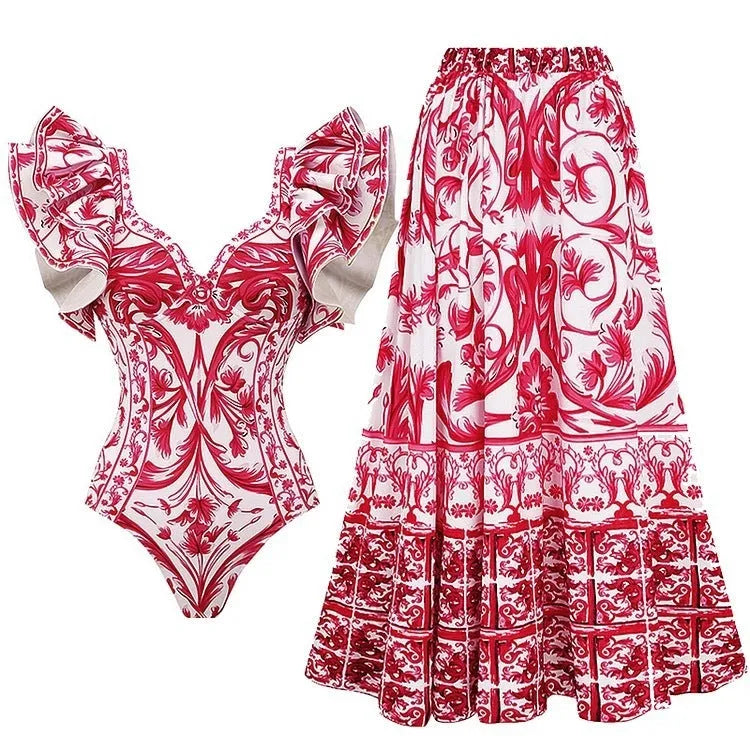 Women's printed polyester one-piece swimsuit on a hanger, showing rose pink, blue, white, and red colour options.