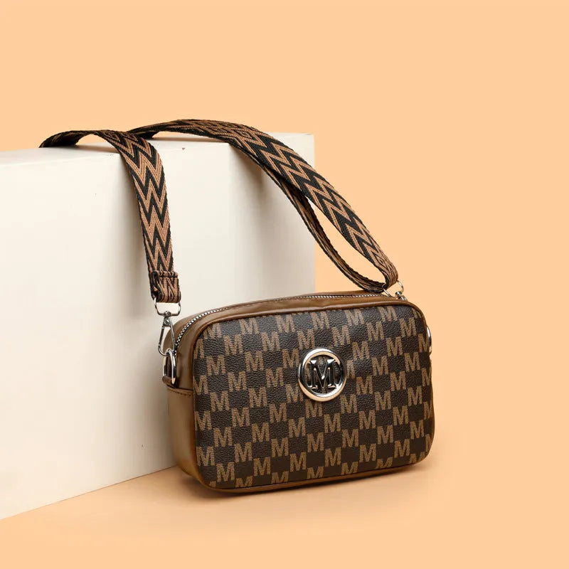 PU leather crossbody bag with wide shoulder strap and three-dimensional front pocket