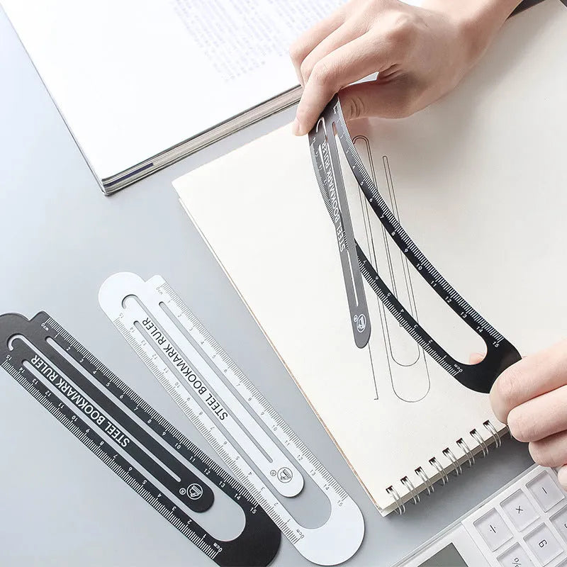 Black and white two-sided steel ruler measuring 12cm in length