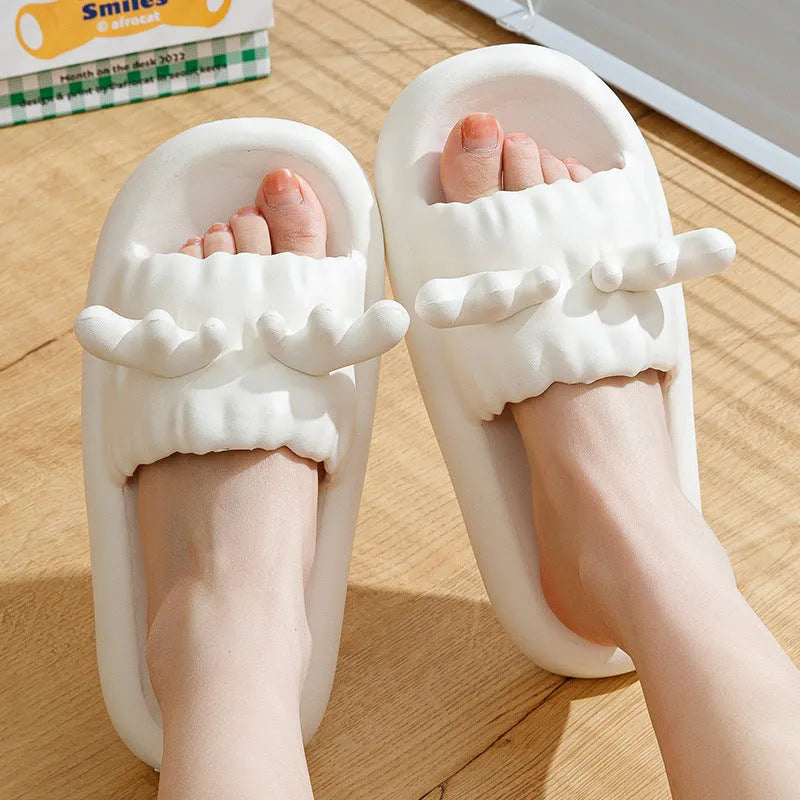 Women's white EVA flip flop slippers with raised deer horn design on the upper and a textured non-slip sole.