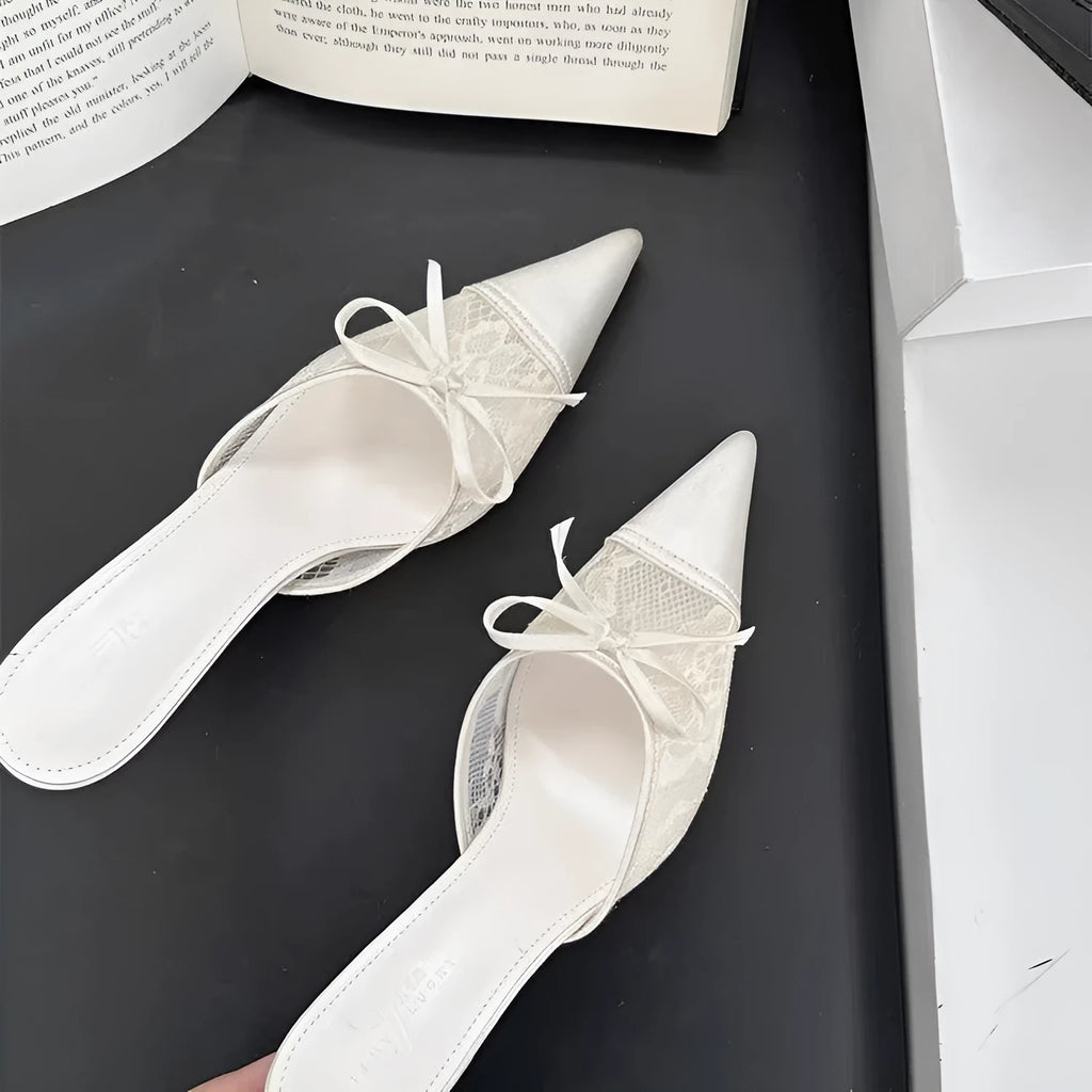 Light brown women's lace high heels with a pointed toe and a decorative bowknot on the upper.