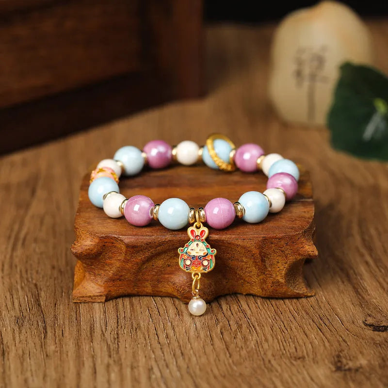 Lucky Rabbit ceramic bracelet with gray porcelain glaze on adjustable cord