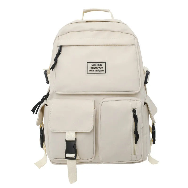 Black and white nylon student backpack with front pockets and laptop compartment.