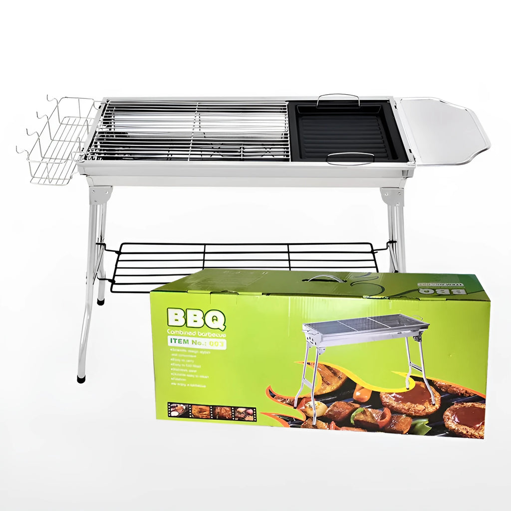 Large stainless steel turnover barbecue oven with charcoal grill and cooking accessories.