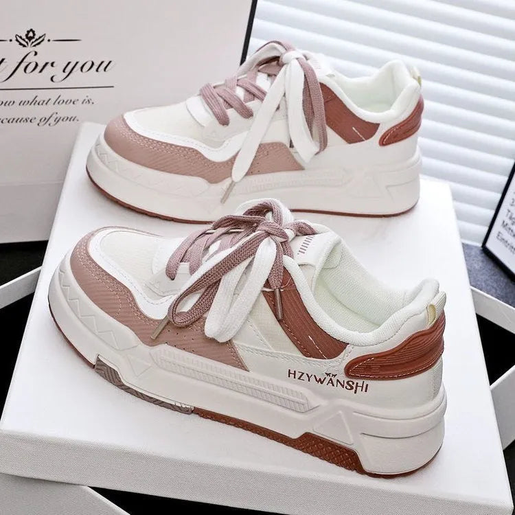 Beige children's lace-up board shoes with cross shoulder straps and a thick rubber sole.