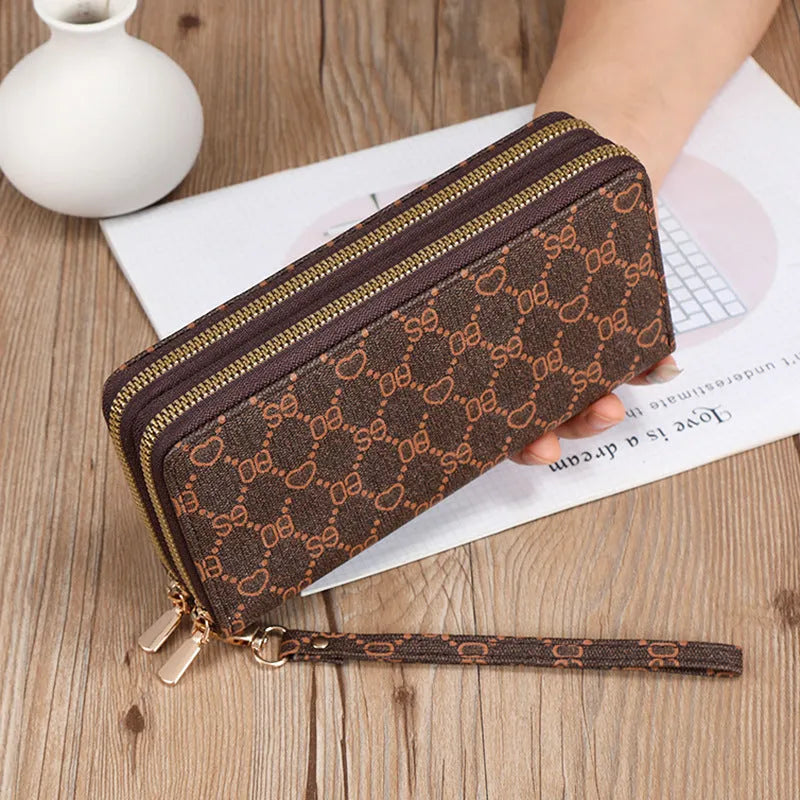 Long black PU leather wallet clutch with phone slot, card holders, and zippered coin purse