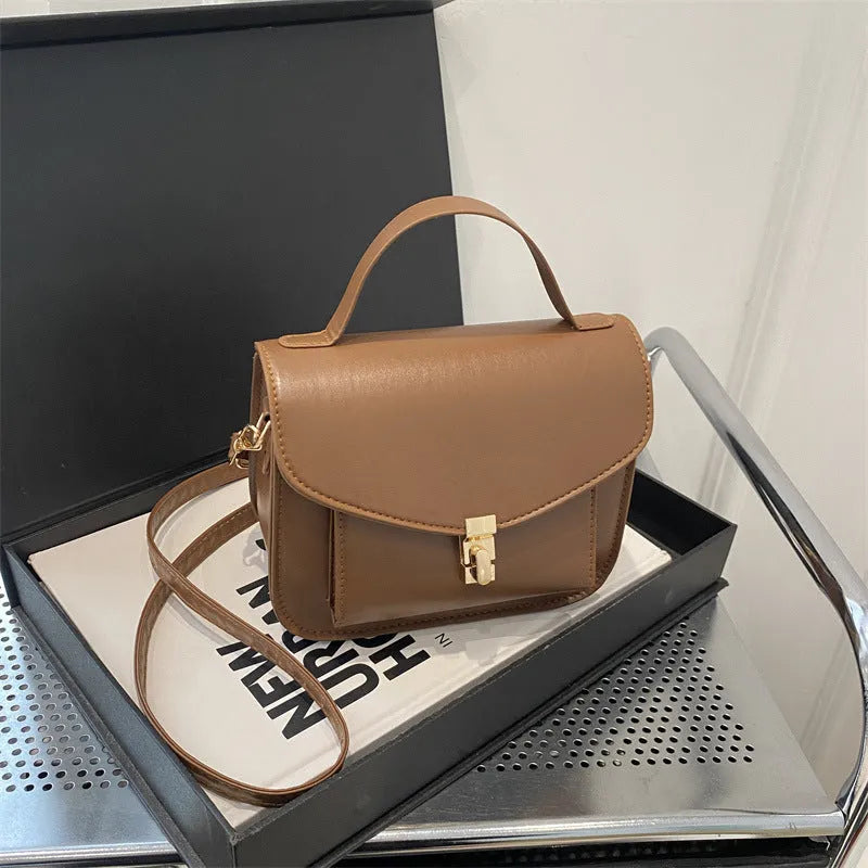 Retro style horizontal square messenger bag in PU material with crossbody strap and document compartment