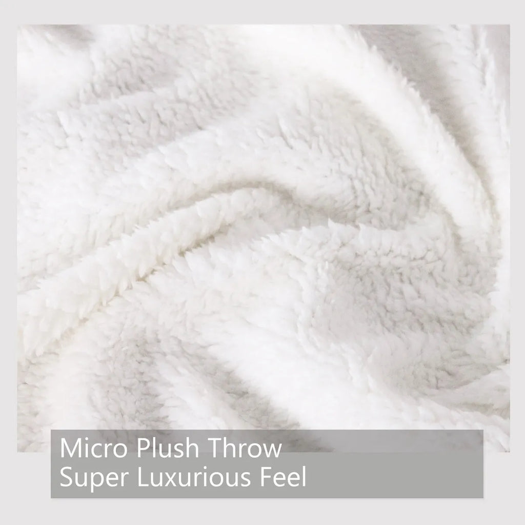 Dinosaur themed lamb wool blanket in white on a sofa, measuring 130x150cm or 150x200cm