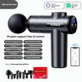 Konka V19 grey mini massage gun with multiple massage heads on a table.
