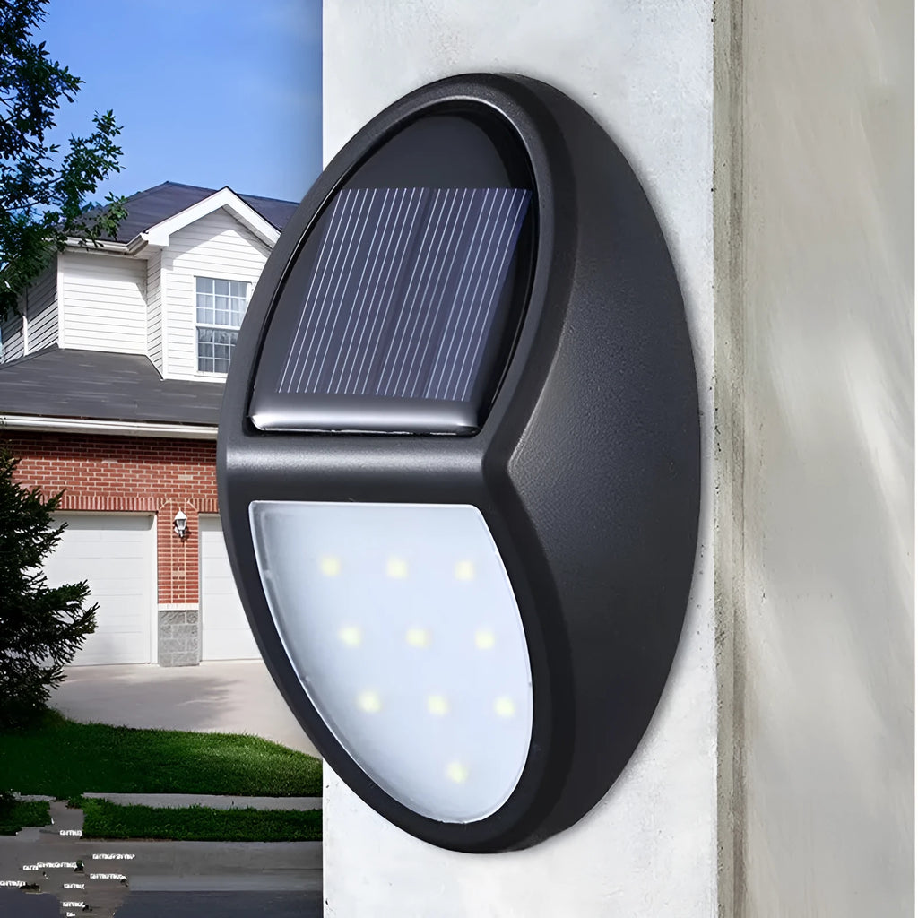 Black solar-powered LED wall light with automatic sensor for outdoor garden or patio illumination