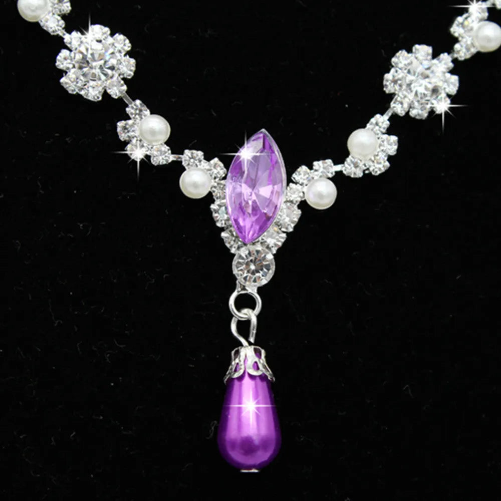 Drop pearl necklace and earrings set in white, blue, and pink for bridal and formal occasions