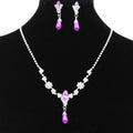 Drop pearl necklace and earrings set in white, blue, and pink for bridal and formal occasions