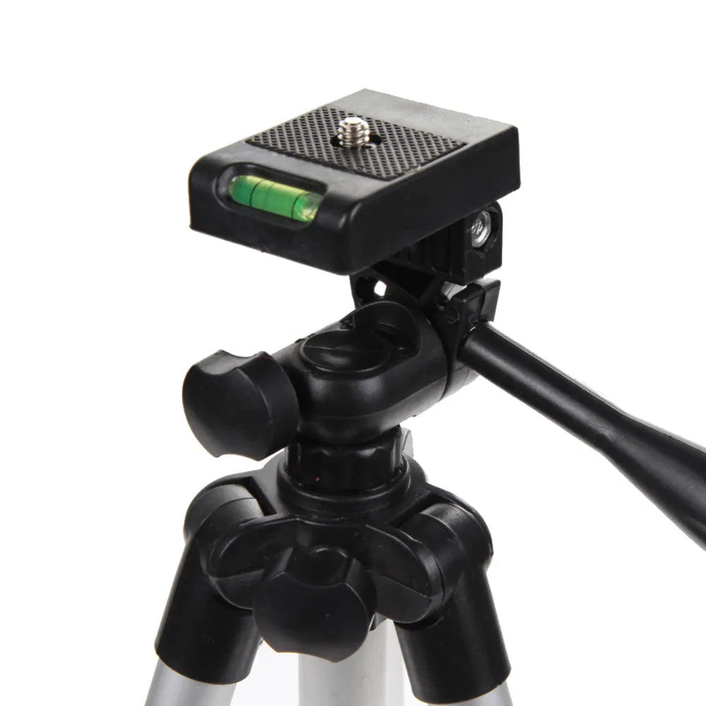 White aluminium alloy compact portable camera tripod with 4-section legs and PTZ set, folded for travel