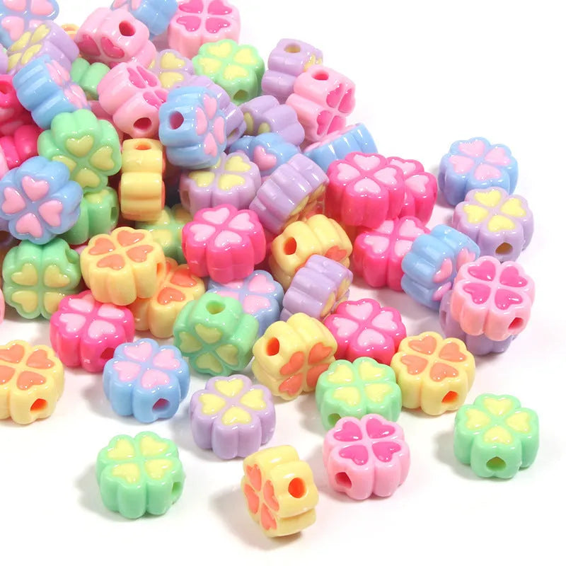 15mm frosted acrylic clover beads in mixed colours including pink, green, blue, and purple