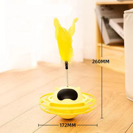 Pink cat tumbler turntable toy with interactive play stick on a flat surface.