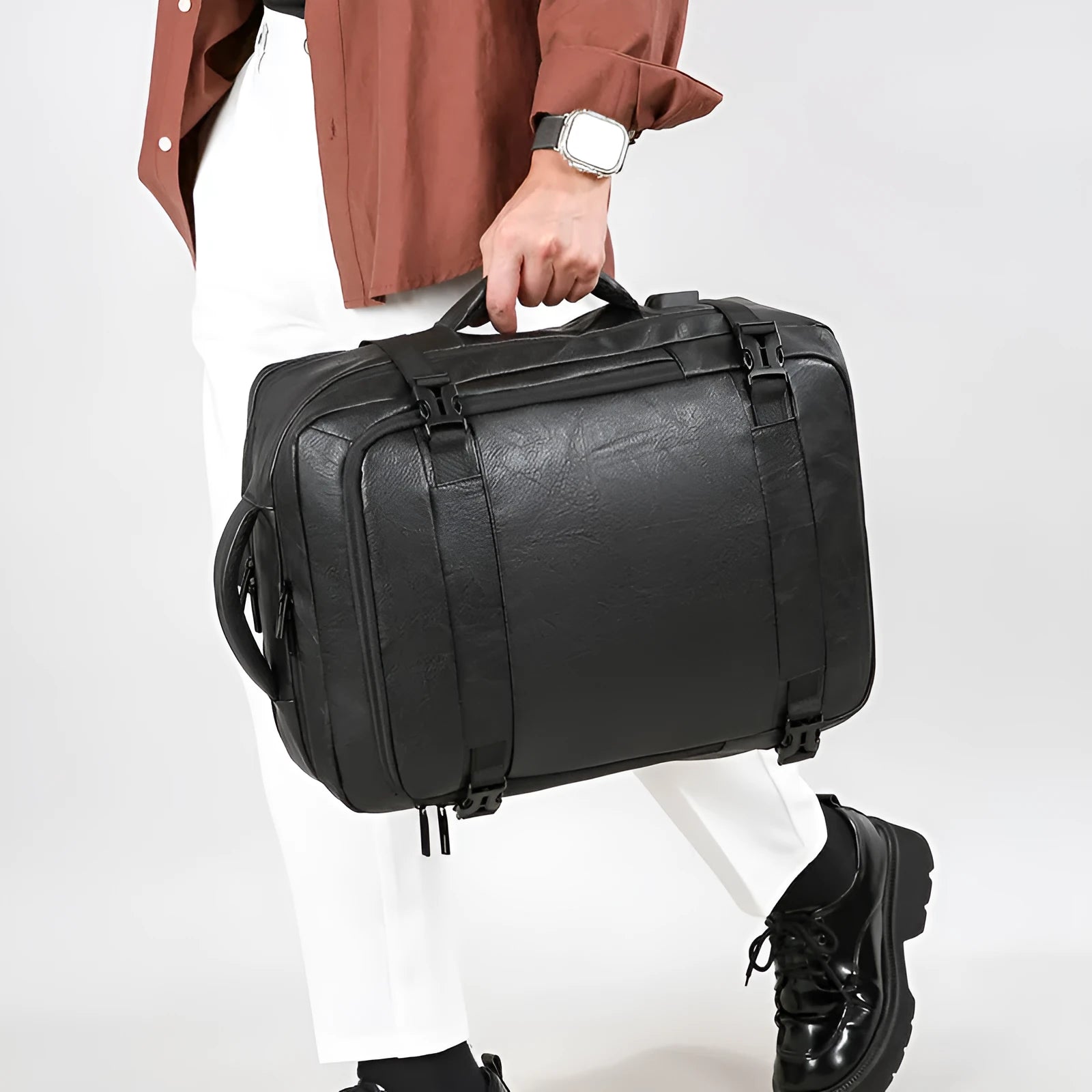 Multi-functional scalable computer backpack in solid black colour, PU waterproof finish, 20-35 litre capacity